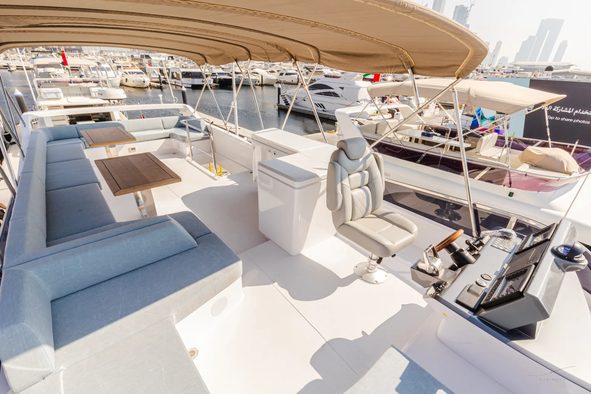 Bianco 56 flybridge deck with marina backdrop