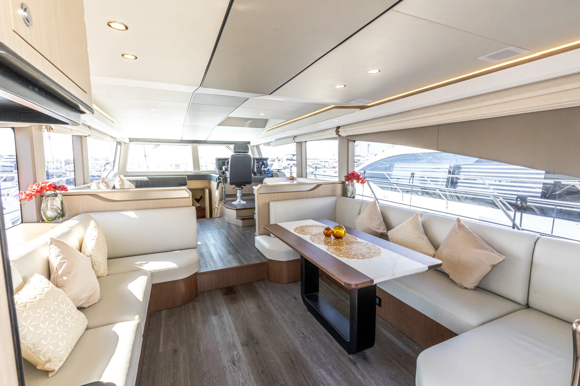 Bianco 56 main saloon with L-sofa and dining