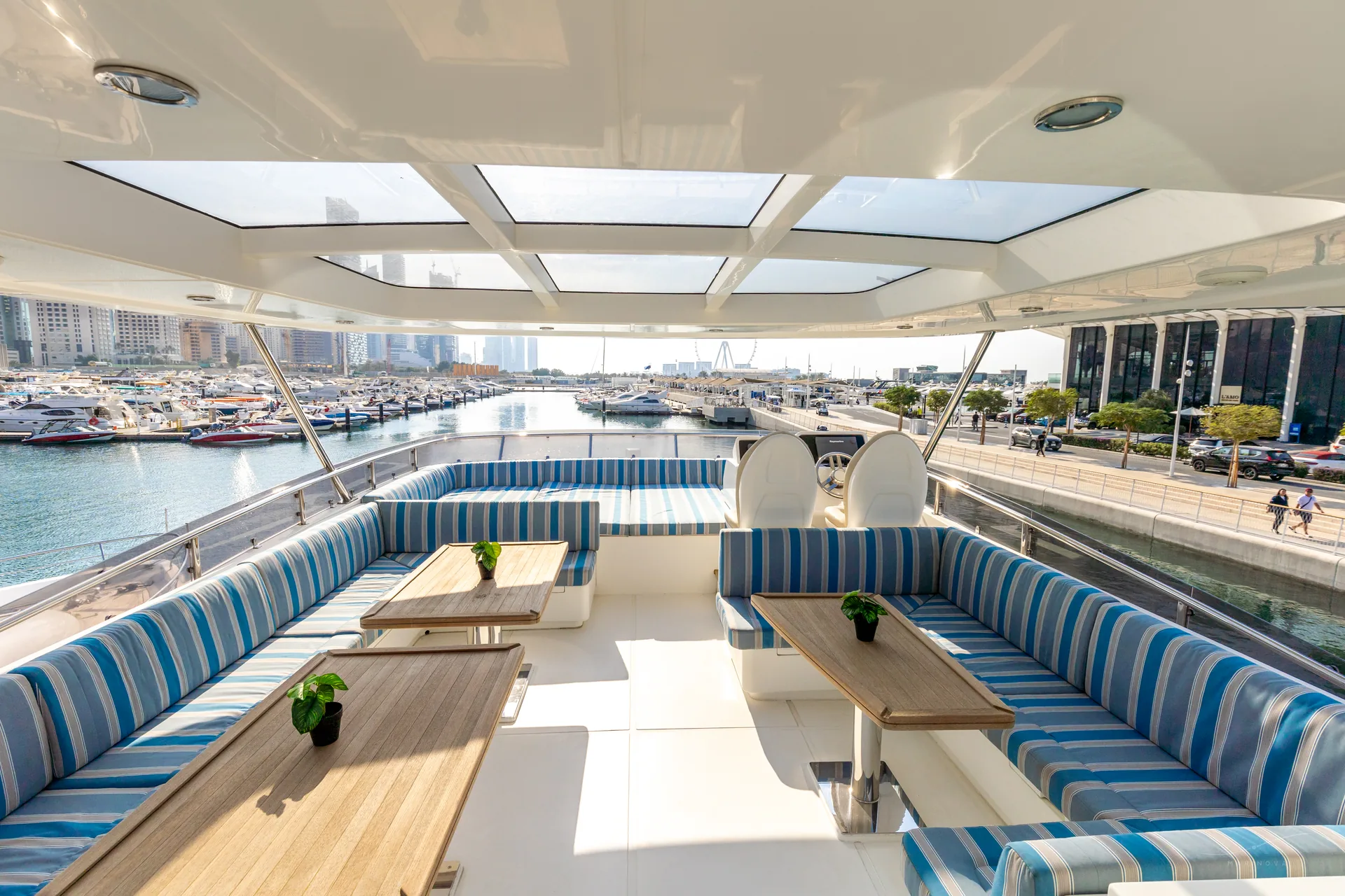 Fuego 96 large flybridge with glass skylights and twin dining