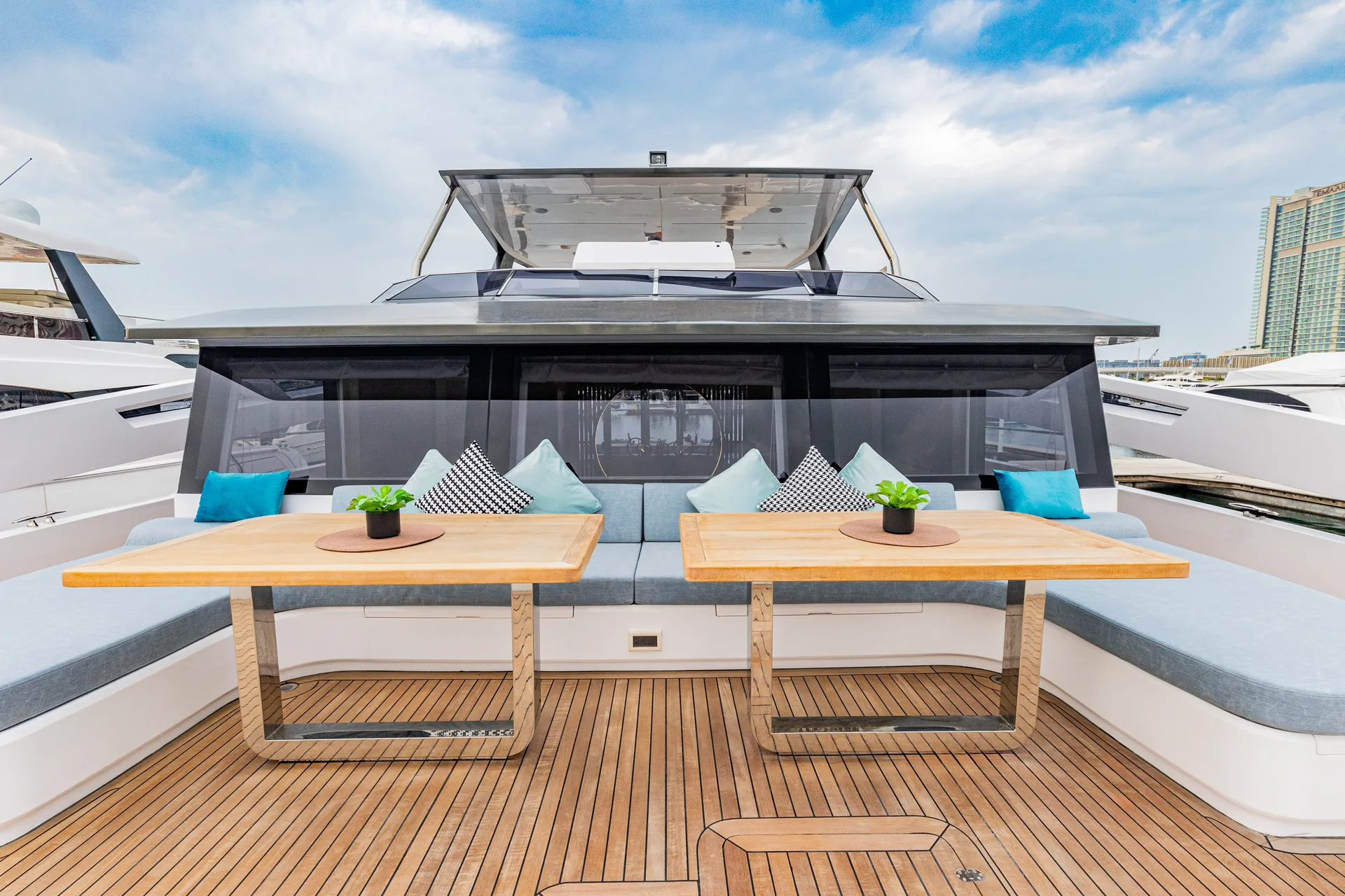 Isla 60 twin bow dining tables on teak deck
