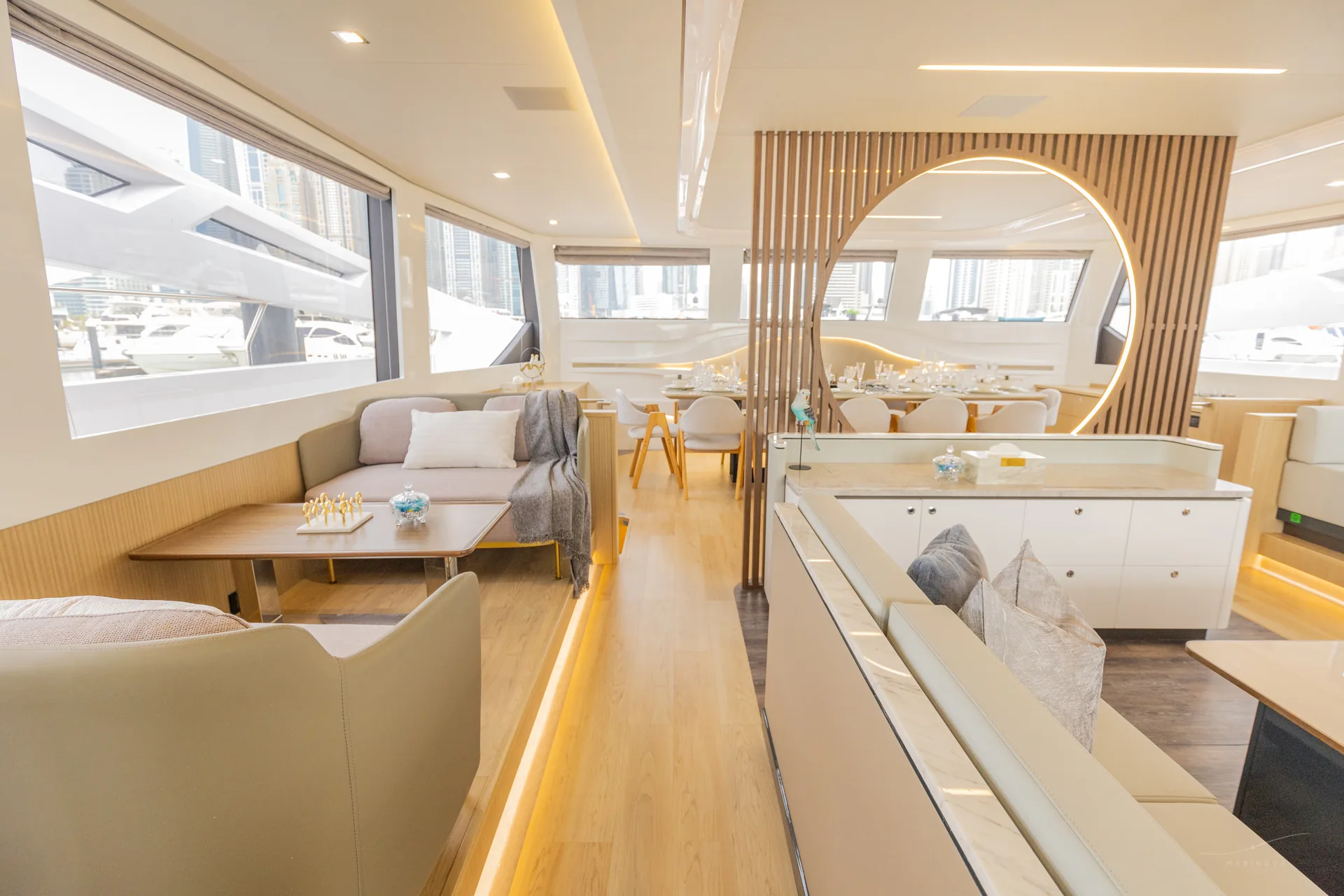 Isla 60 main saloon with Dubai Marina through windows