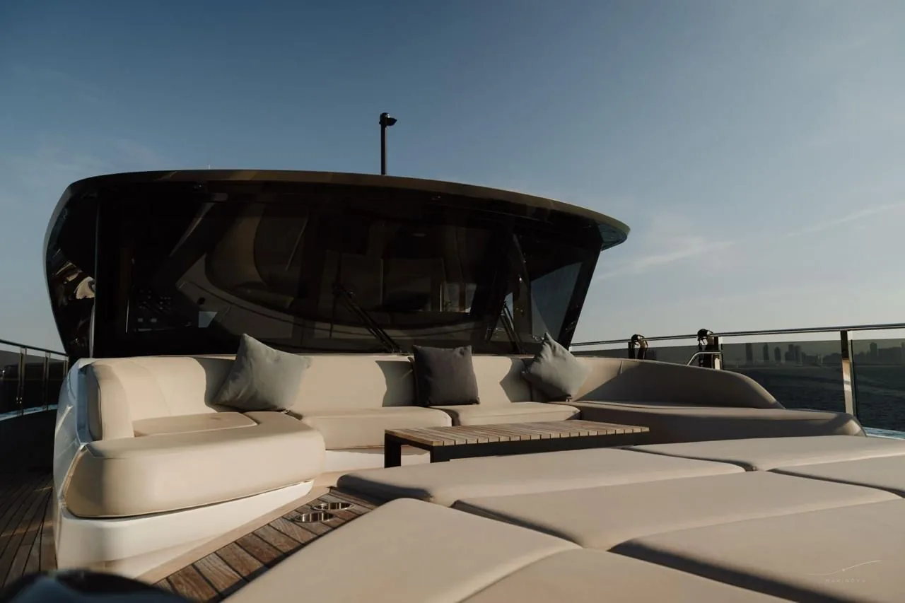 Princess X95 flybridge at golden hour with the Dubai skyline