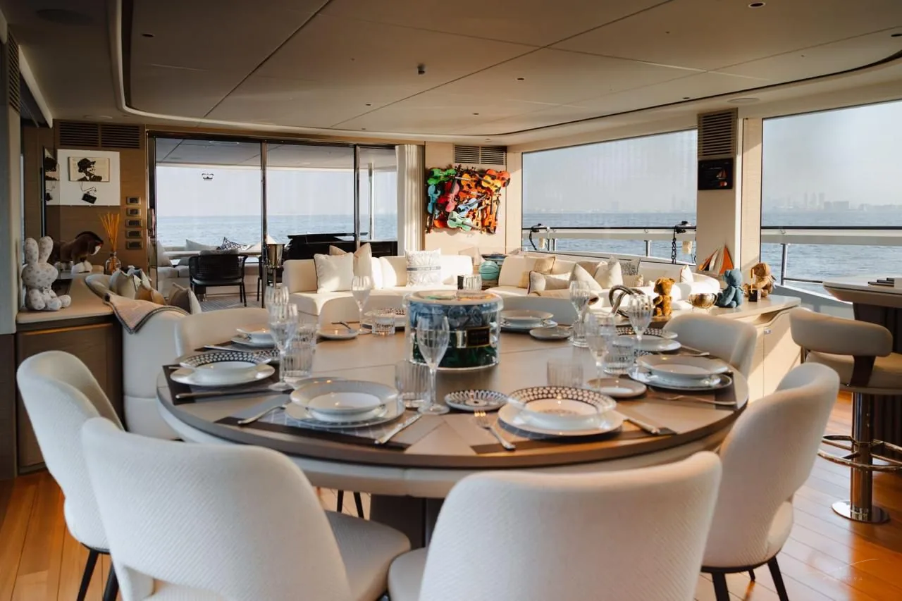 Princess X95 dining setup with ocean view through aft doors