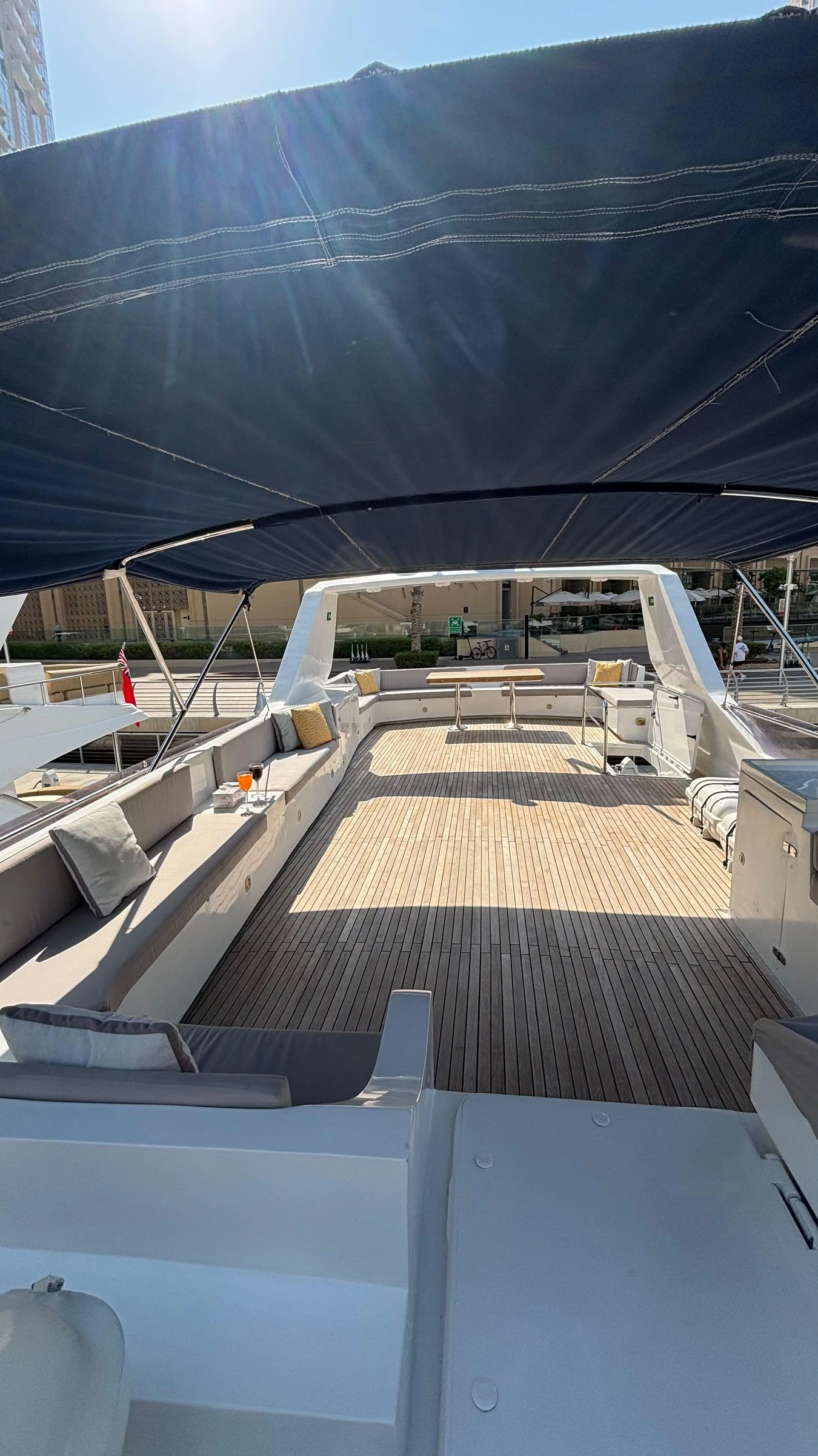 80 feet yacht rental Dubai with a large open flybridge dance floor under the canopy.