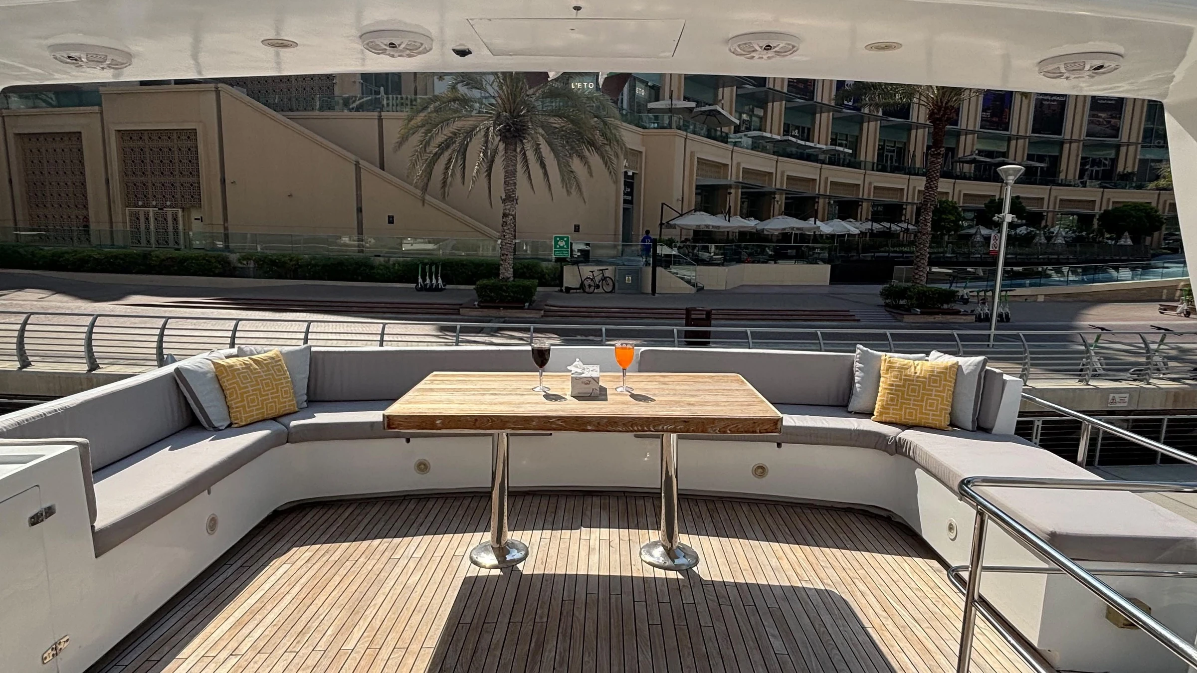 80 feet yacht rental Dubai aft deck lounge with wraparound seating.