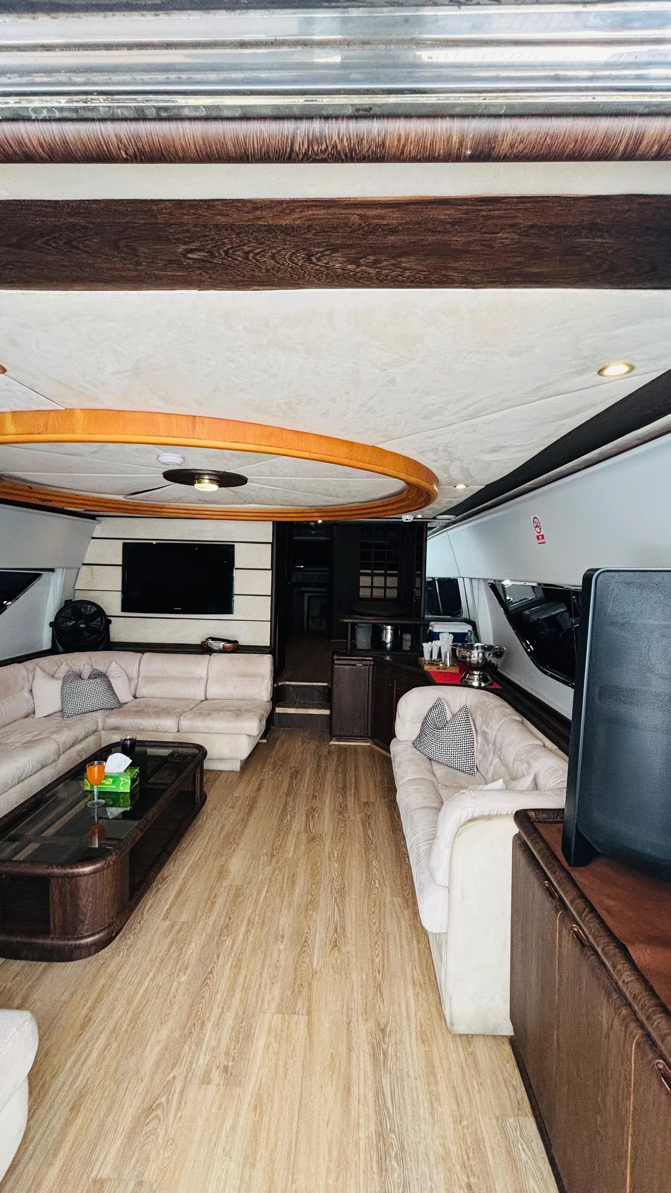 80 feet yacht rental Dubai wide interior saloon with lounge seating.