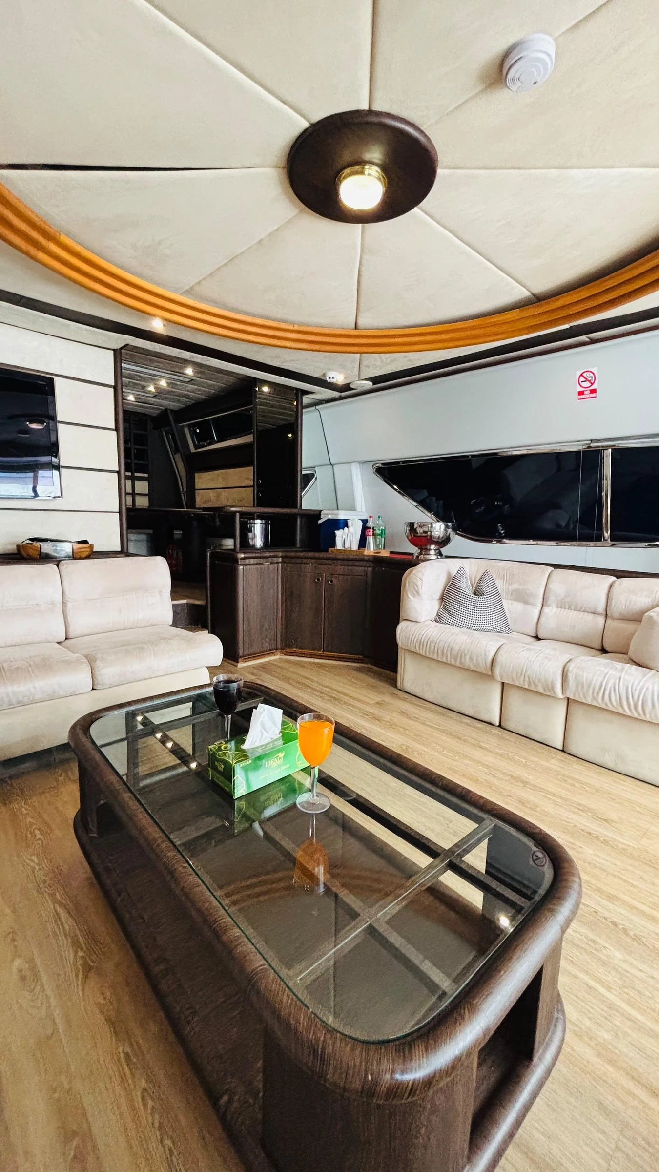80 feet yacht rental Dubai main saloon seating and coffee table.