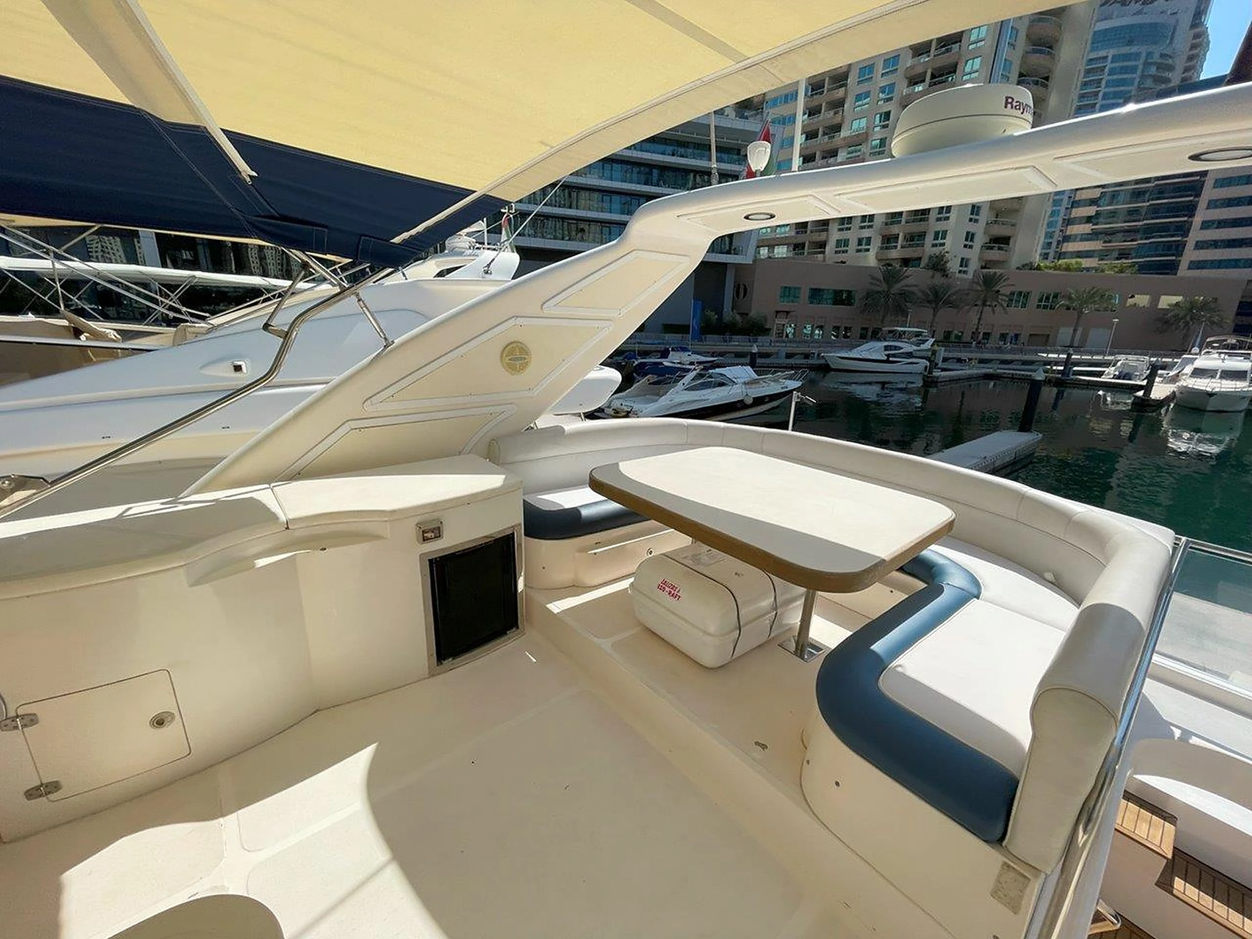 68 feet yacht rental Dubai flybridge seating and dining area aboard Eternity