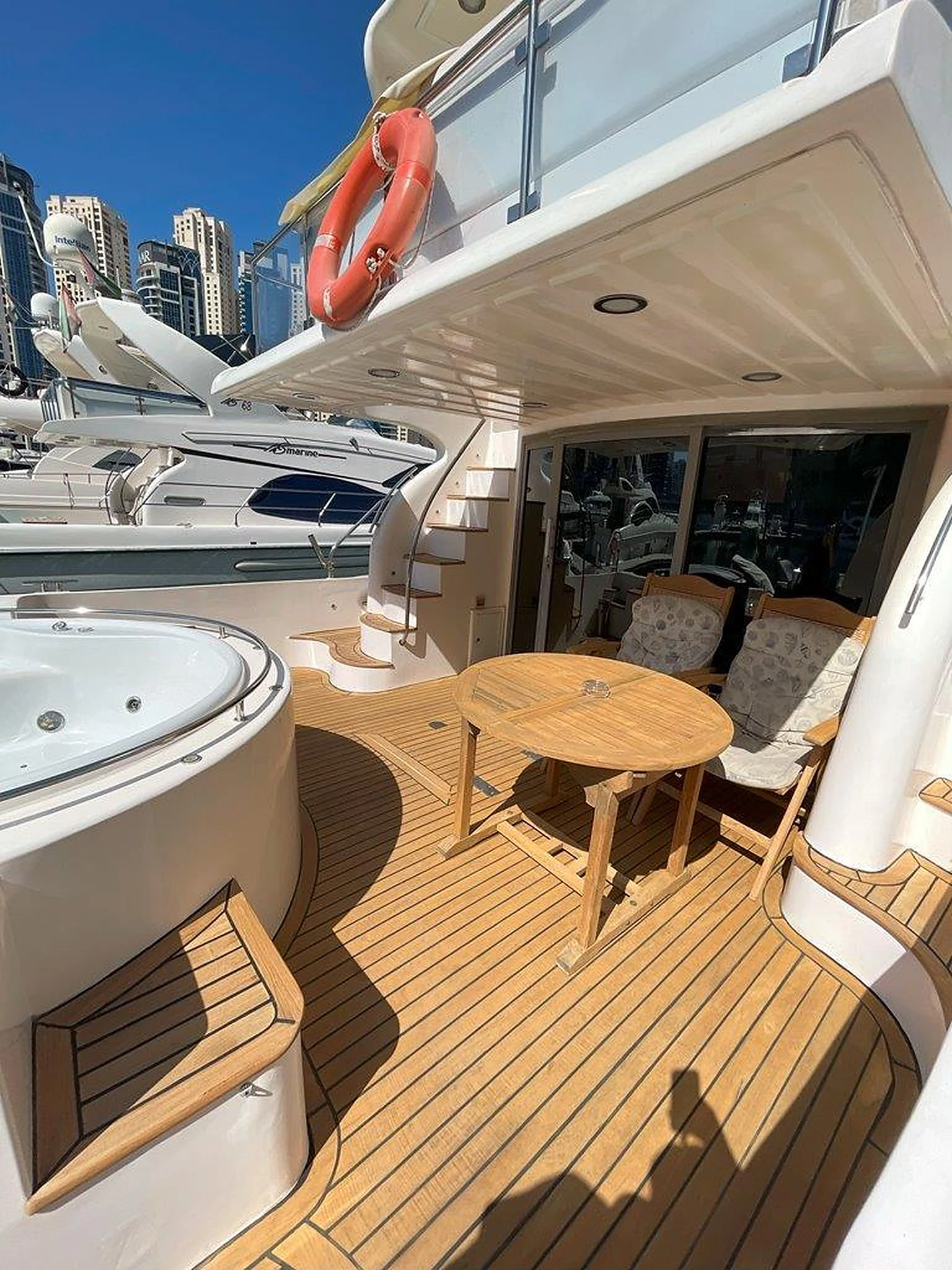68 feet yacht rental Dubai aft deck seating beside the jacuzzi on Eternity