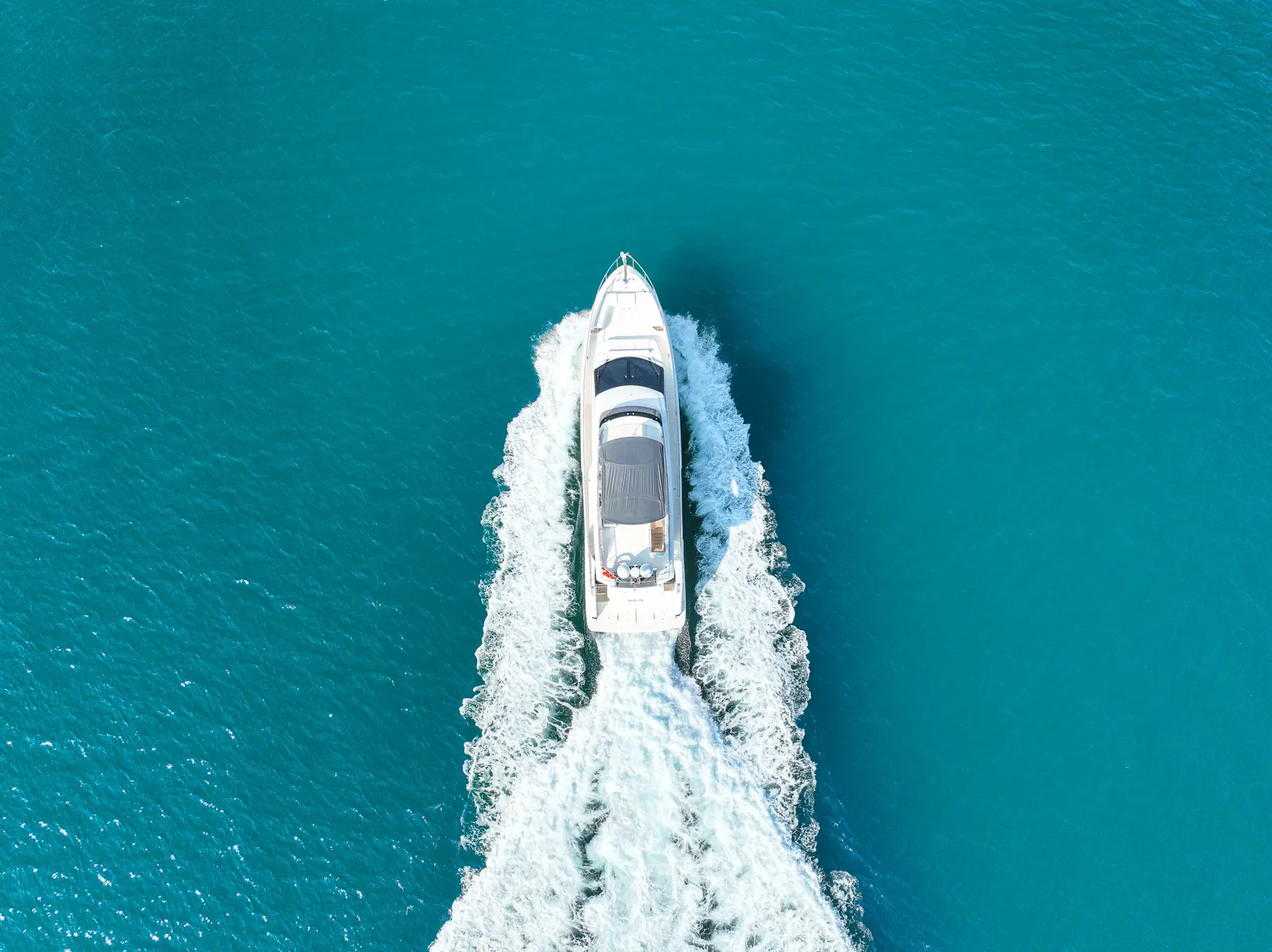 Ferretti 67 aerial top-down on Dubai water