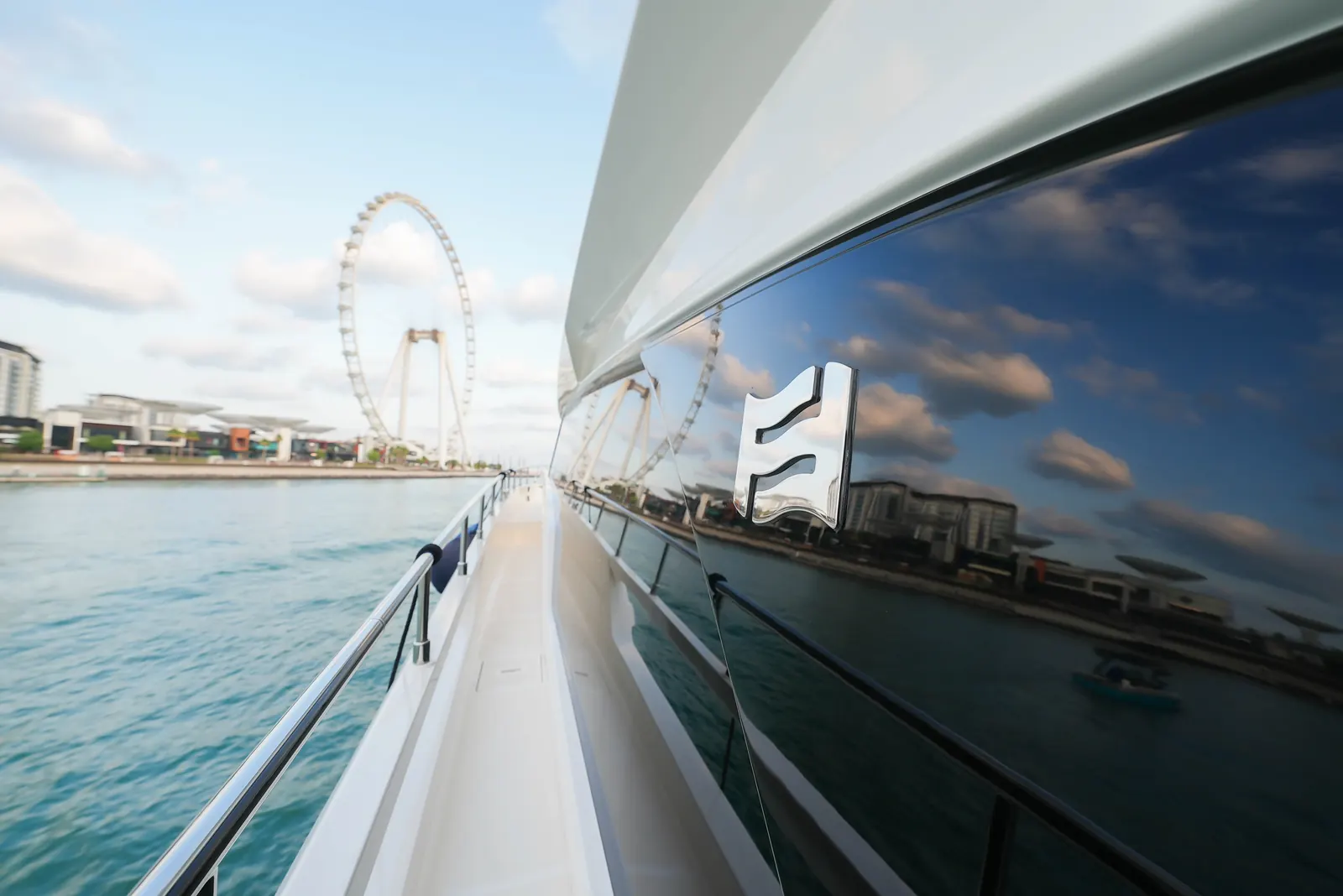 Ferretti 67 side deck with Ain Dubai view