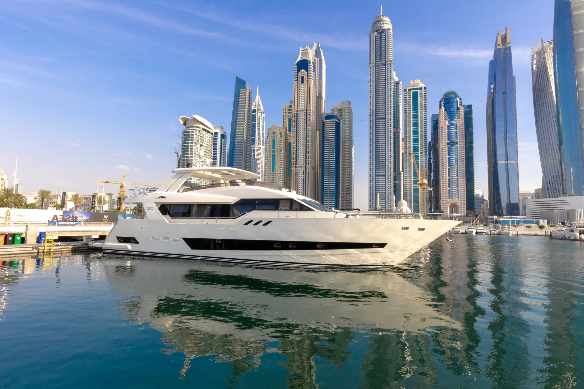 Marinova Caliente 96, a 96 foot white motor yacht photographed on the water, offered as a yacht-only charter for the Abu Dhabi Grand Prix 2026