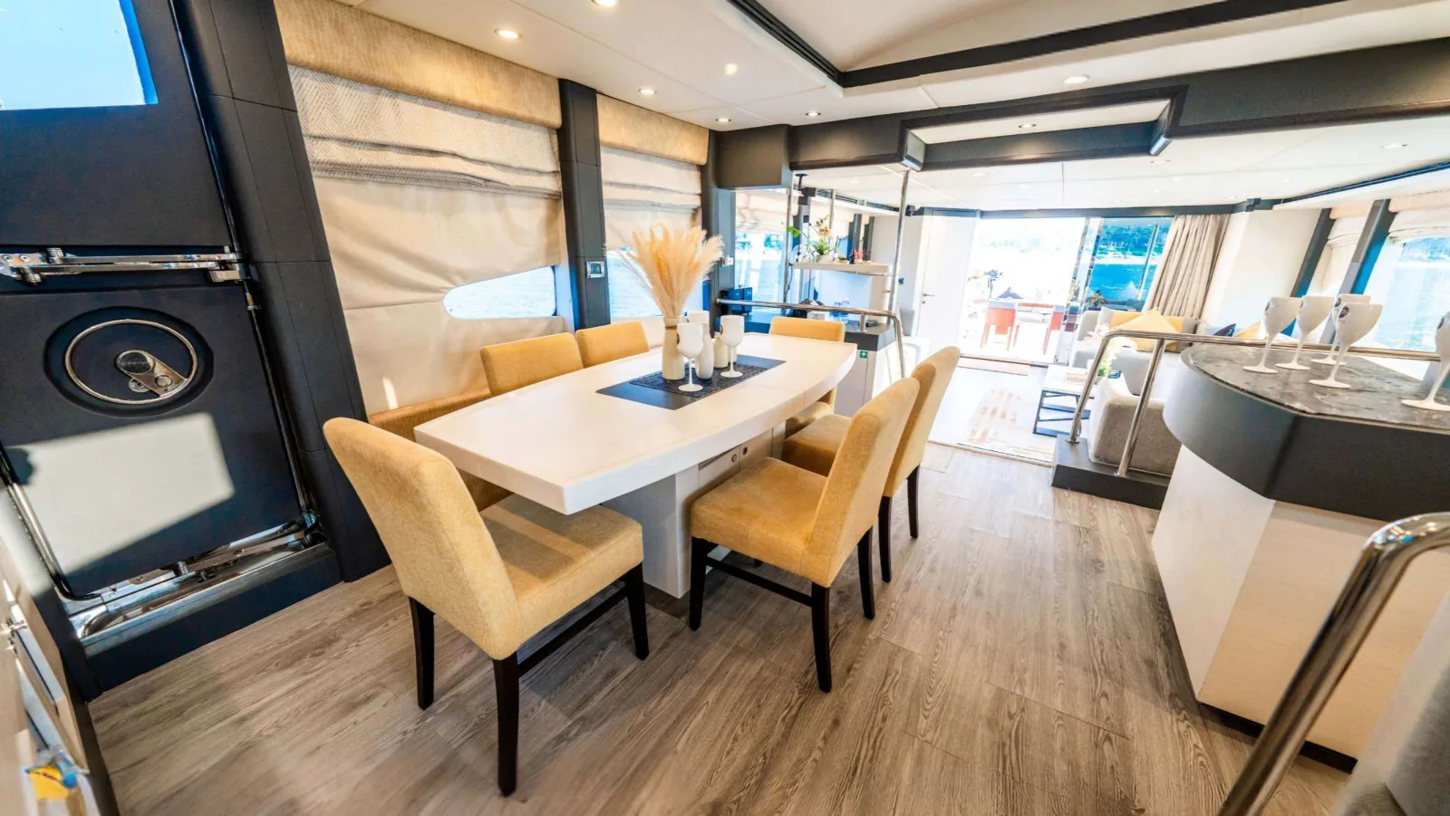 Majesty 77 yacht dining area looking toward the aft doors.