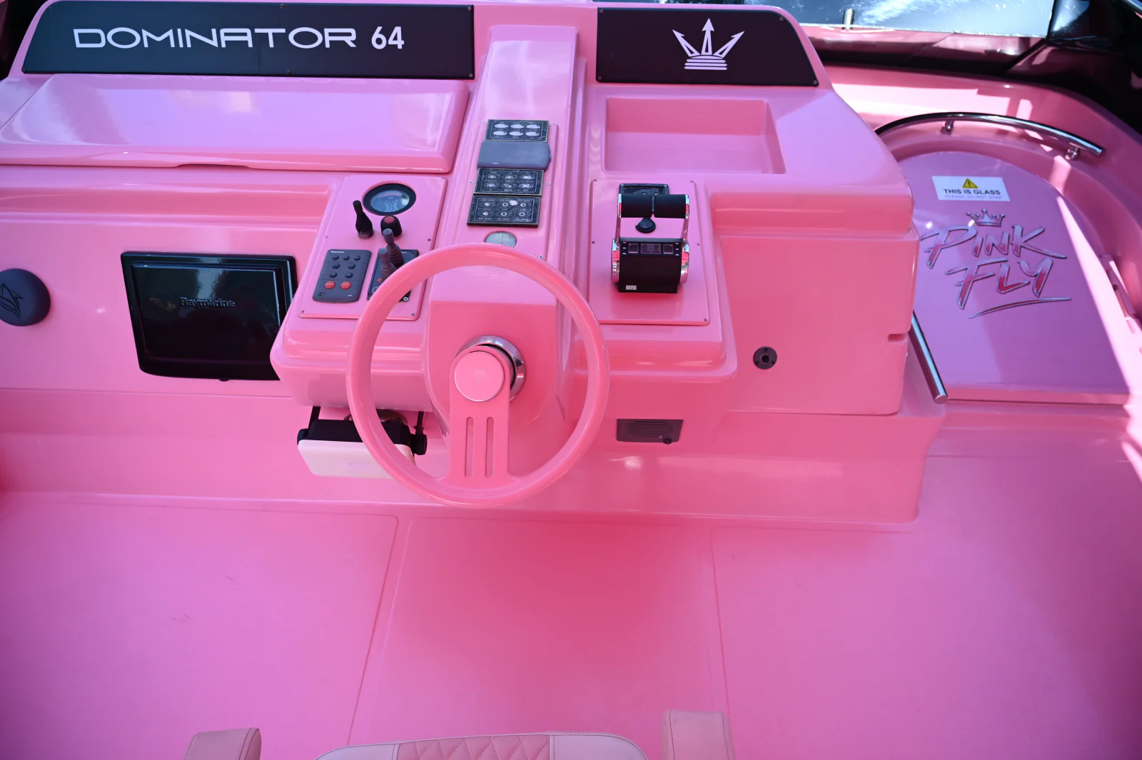 Pink yacht rental Dubai steering station on the Dominator 64 flybridge