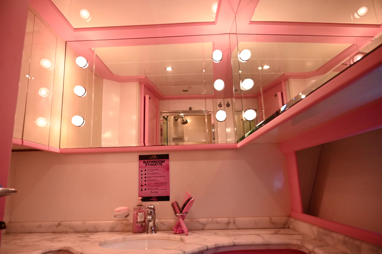 Pink yacht rental Dubai illuminated bathroom mirror and vanity