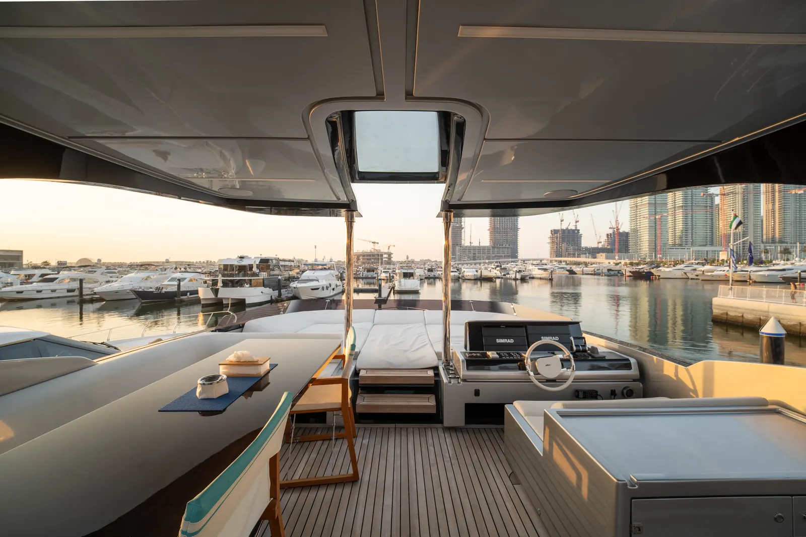 Riva 82 flybridge helm at golden hour