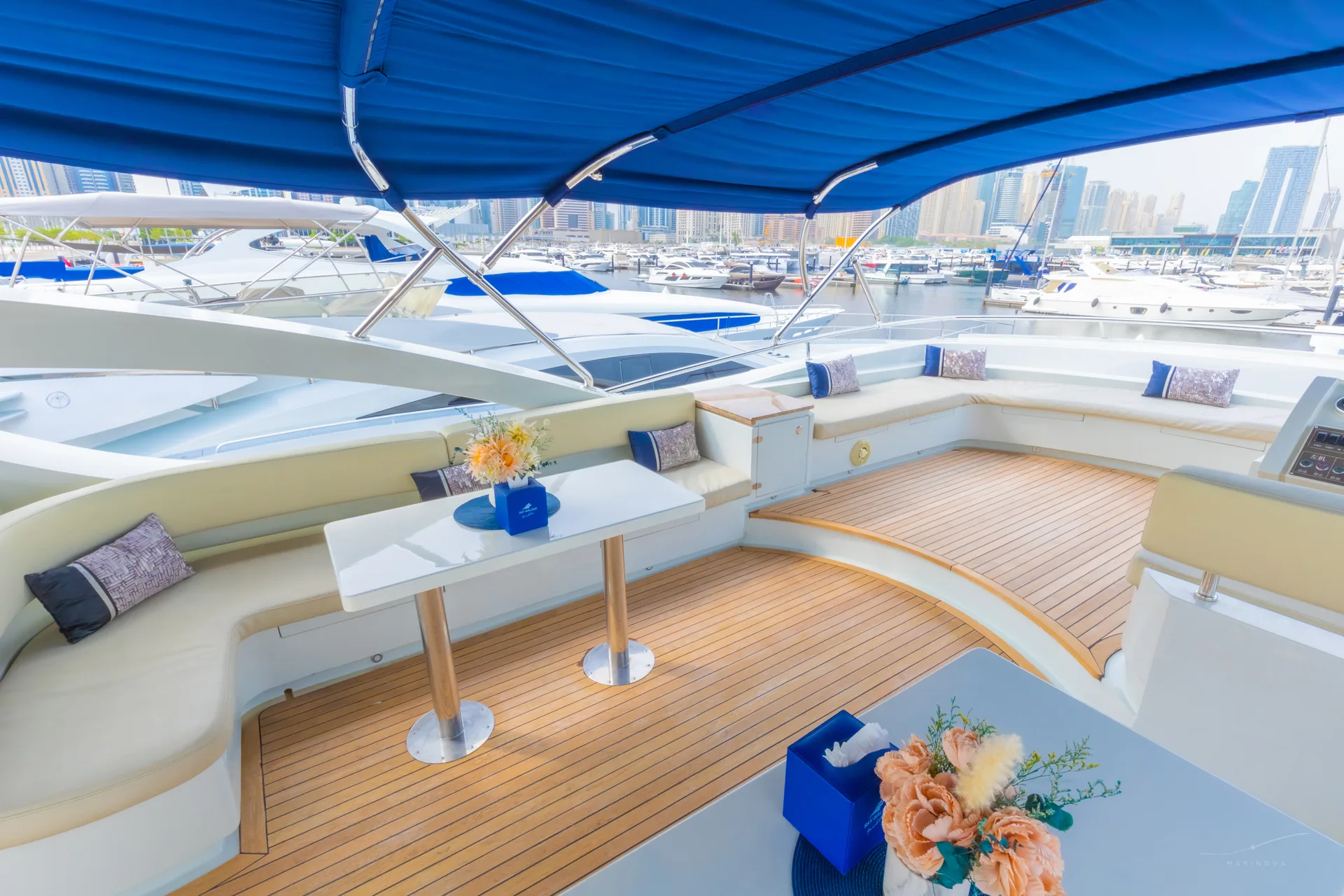 Rosso 110 flybridge with curved benches and marina view